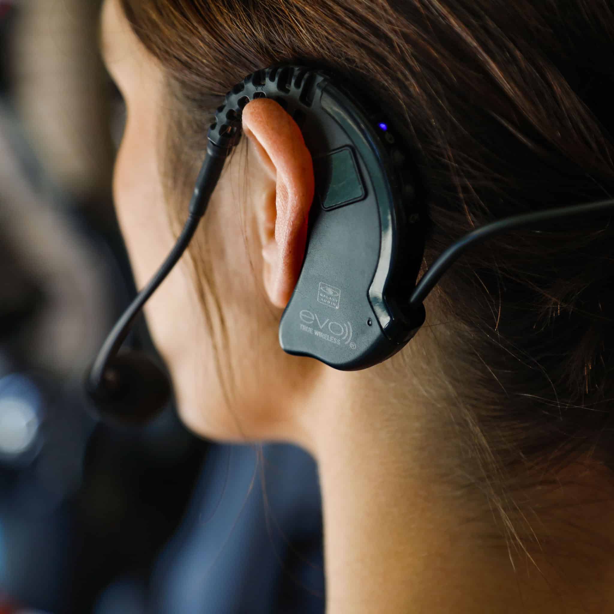 EVO cableless headset mic on fitness instructor as seen from behind